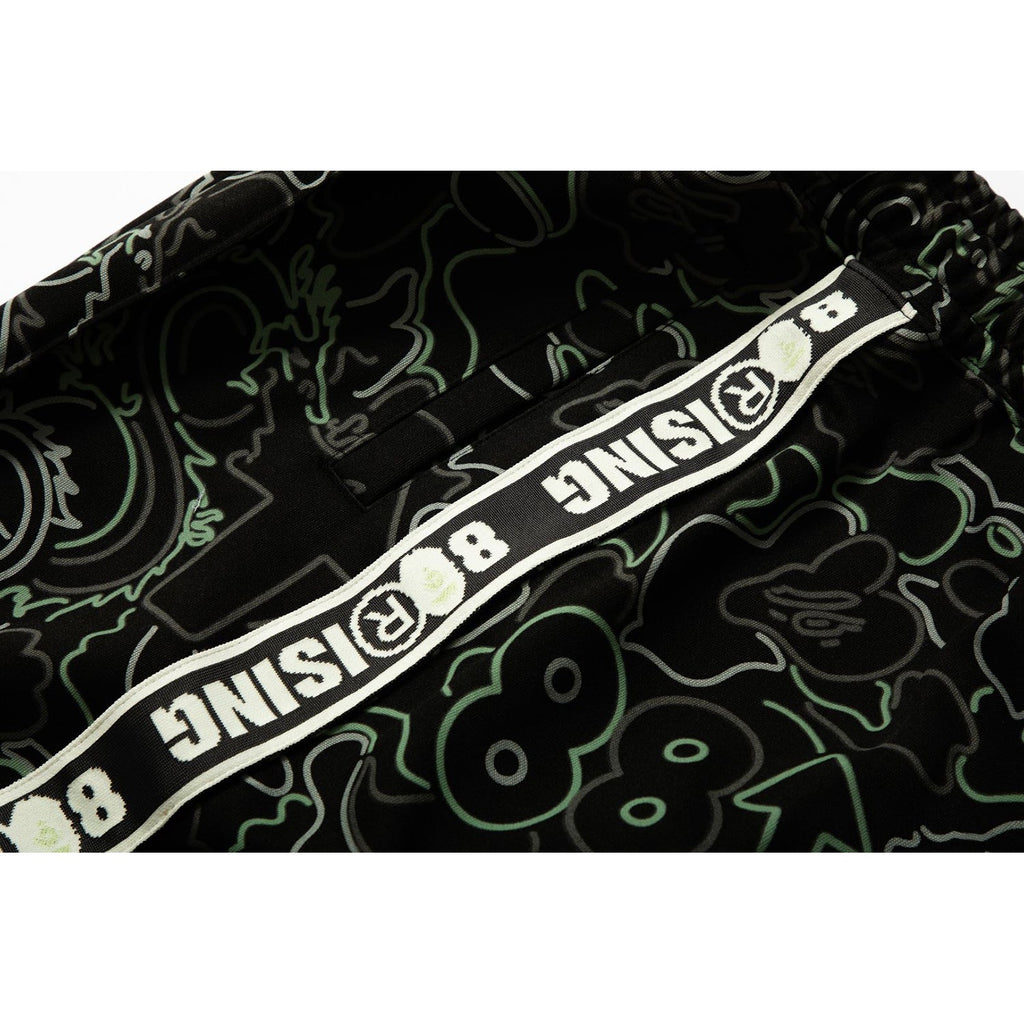 BAPE X 88RISING GLOW IN THE DARK CAMO TRACK PANTS MENS